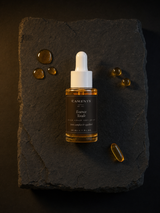 Essence Totale — Huile Visage Tout-en-Un — ingrédients flat lay — CAMENYS